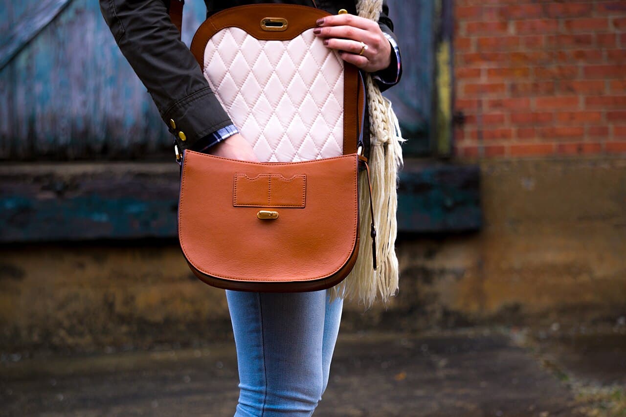 Woman carrying a handbag in warm natural light