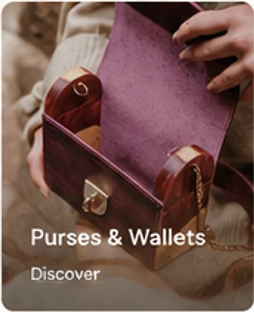 Burgundy purse held by hand